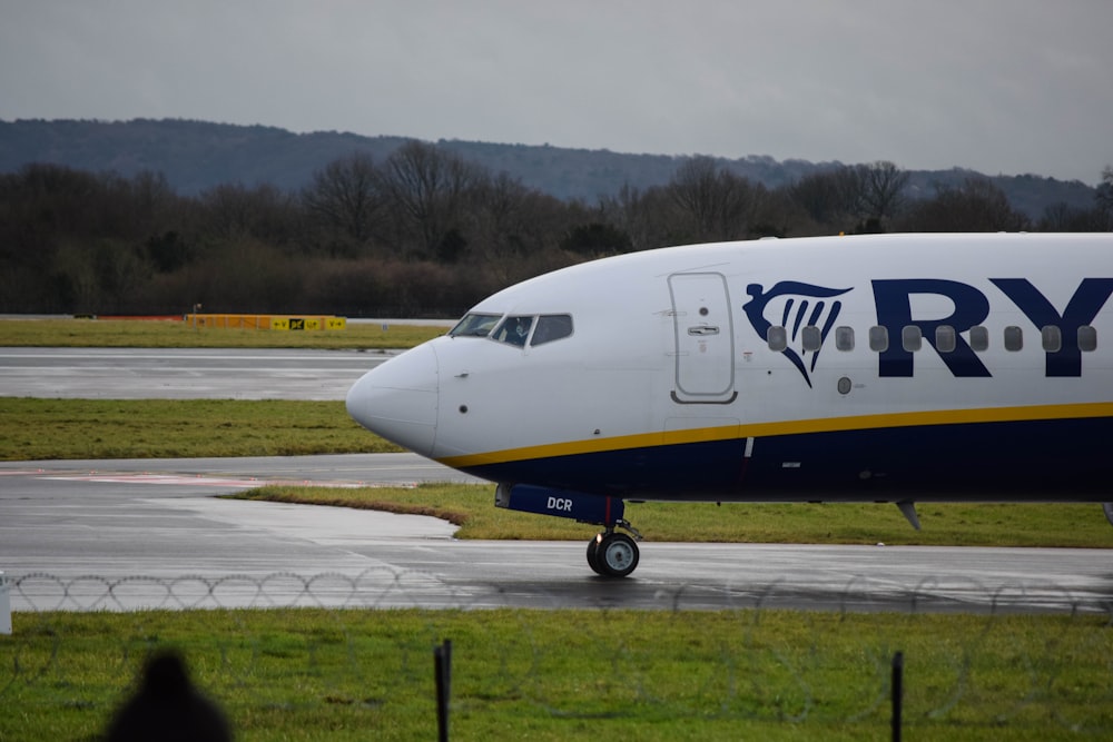 a large passenger jet sitting on top of an airport runway