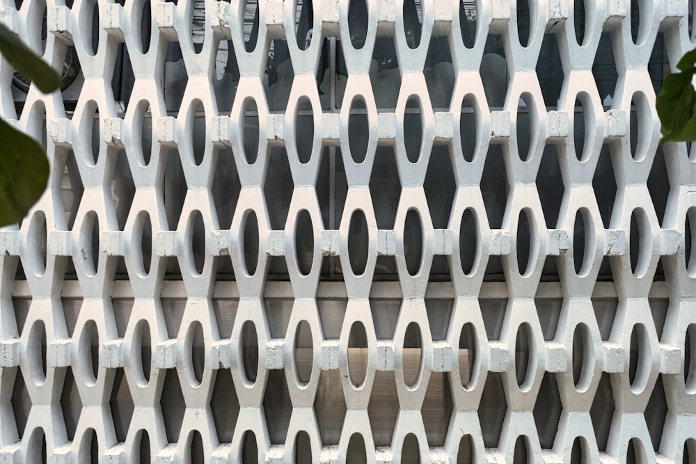 a close up of a building with a plant in front of it