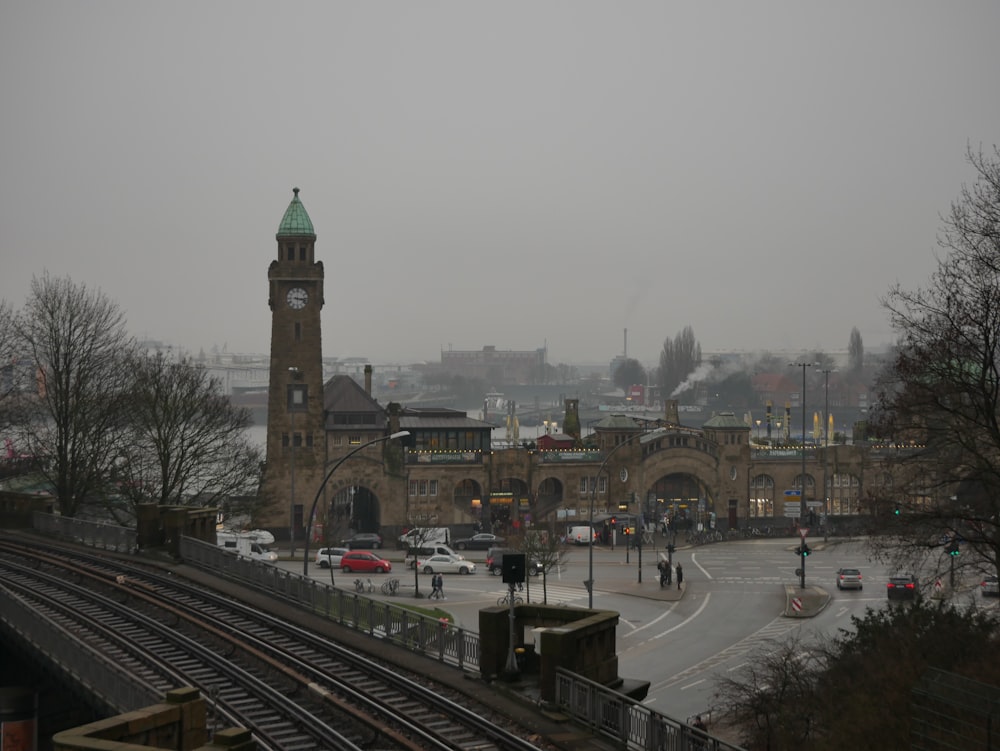 a train station with a clock tower in the background