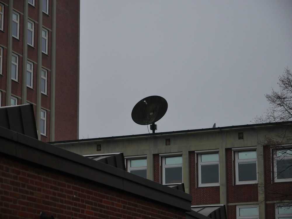 a satellite dish sitting on top of a building