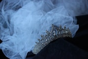 a tiara is sitting on a black cloth