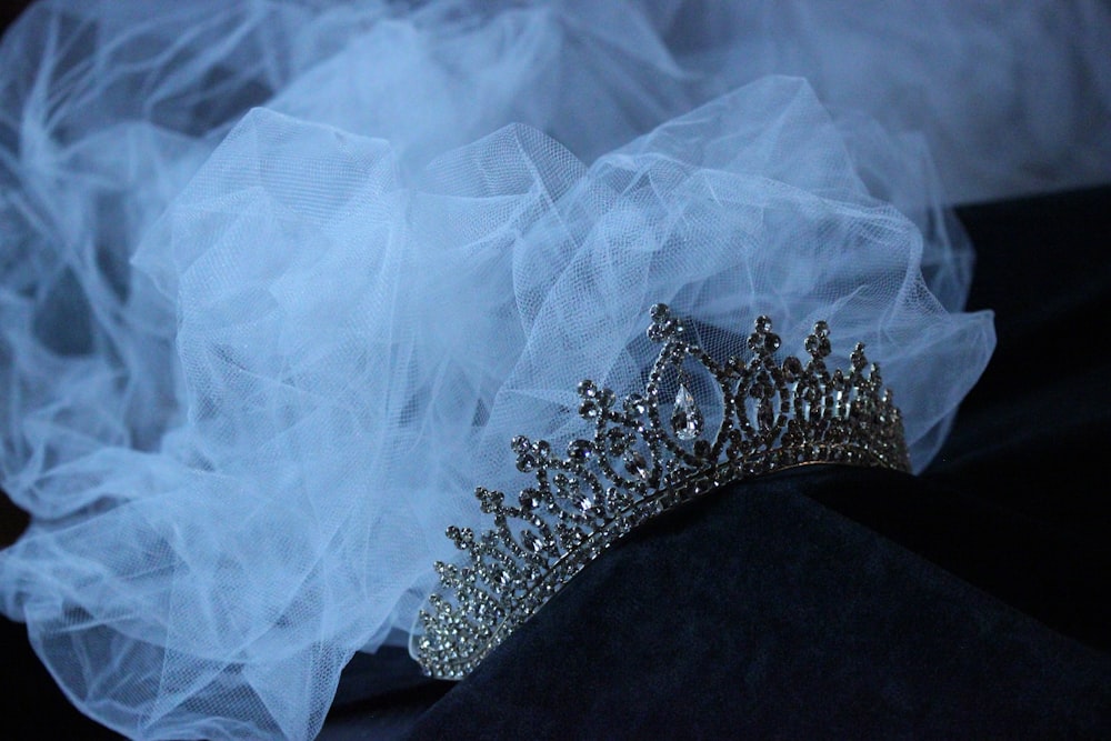 a tiara is sitting on a black cloth