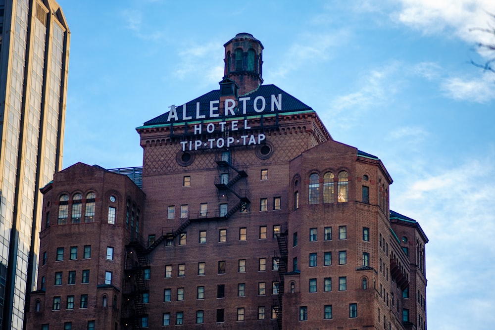 a tall building with a sign on top of it