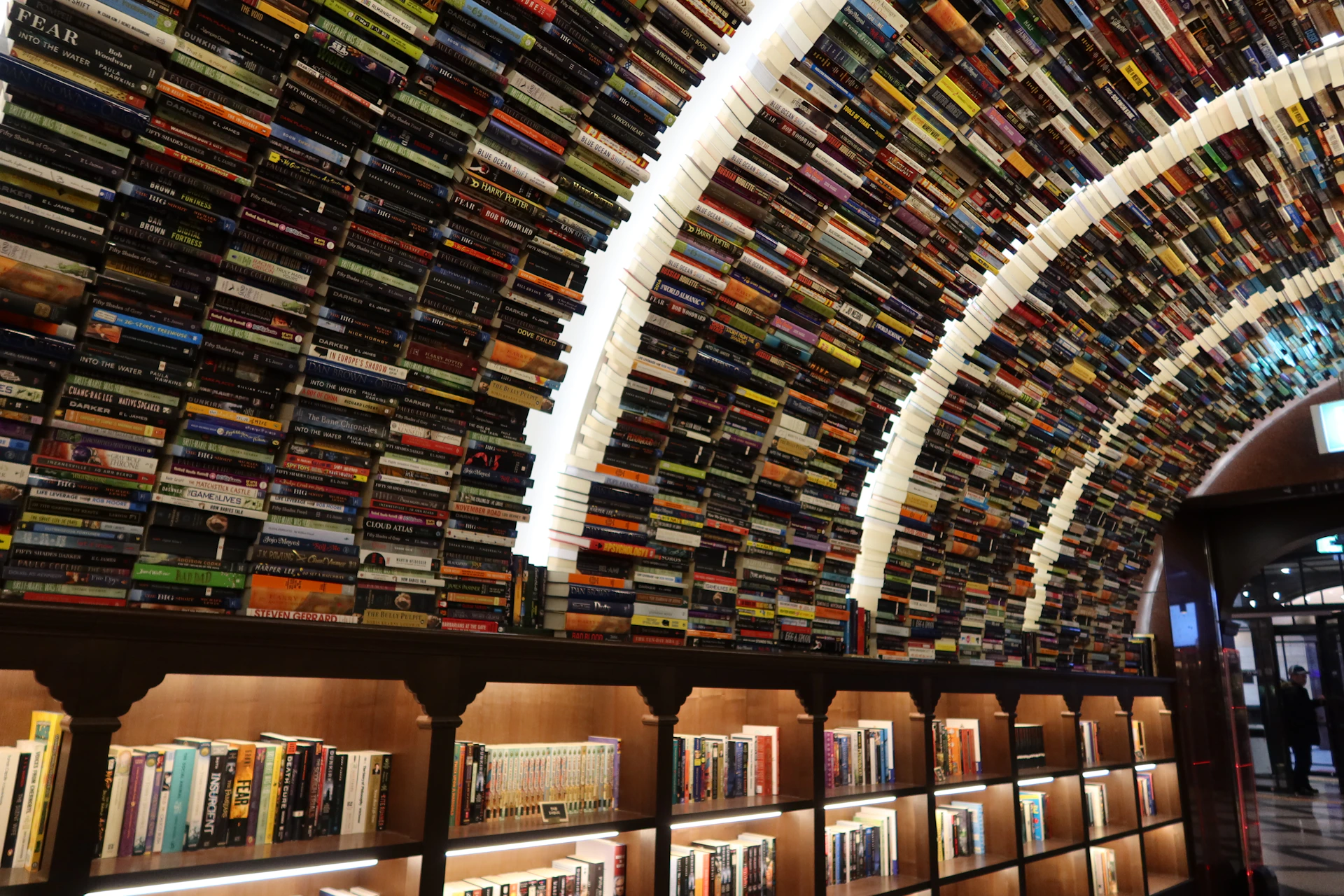 a room filled with lots of books on shelves