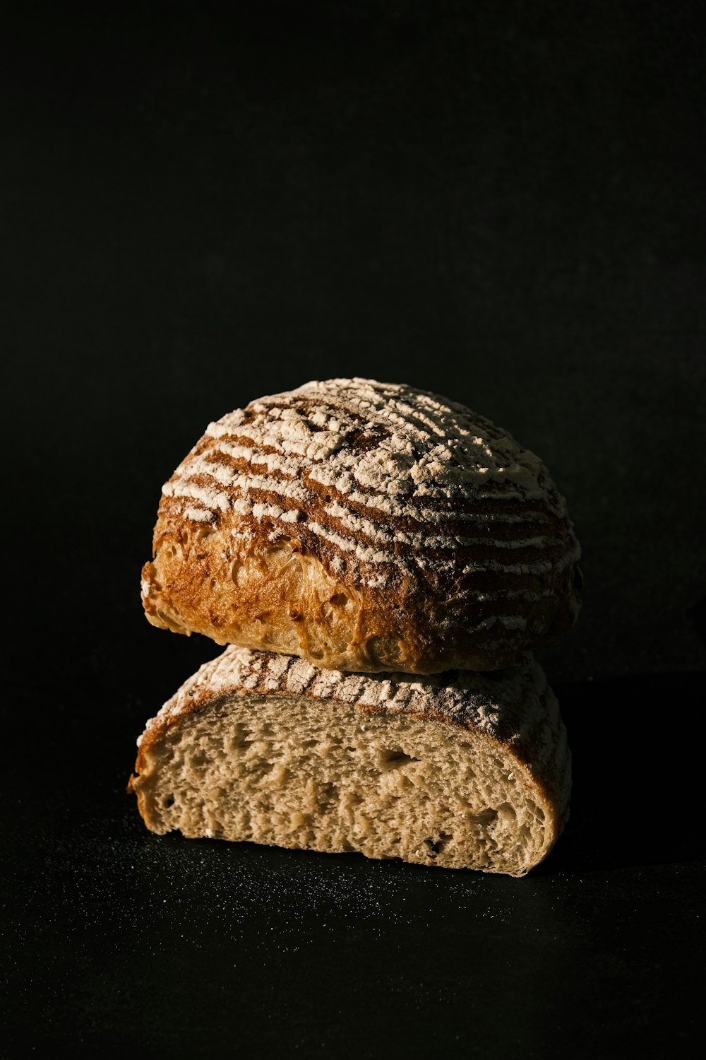 a loaf of bread sitting on top of a black table