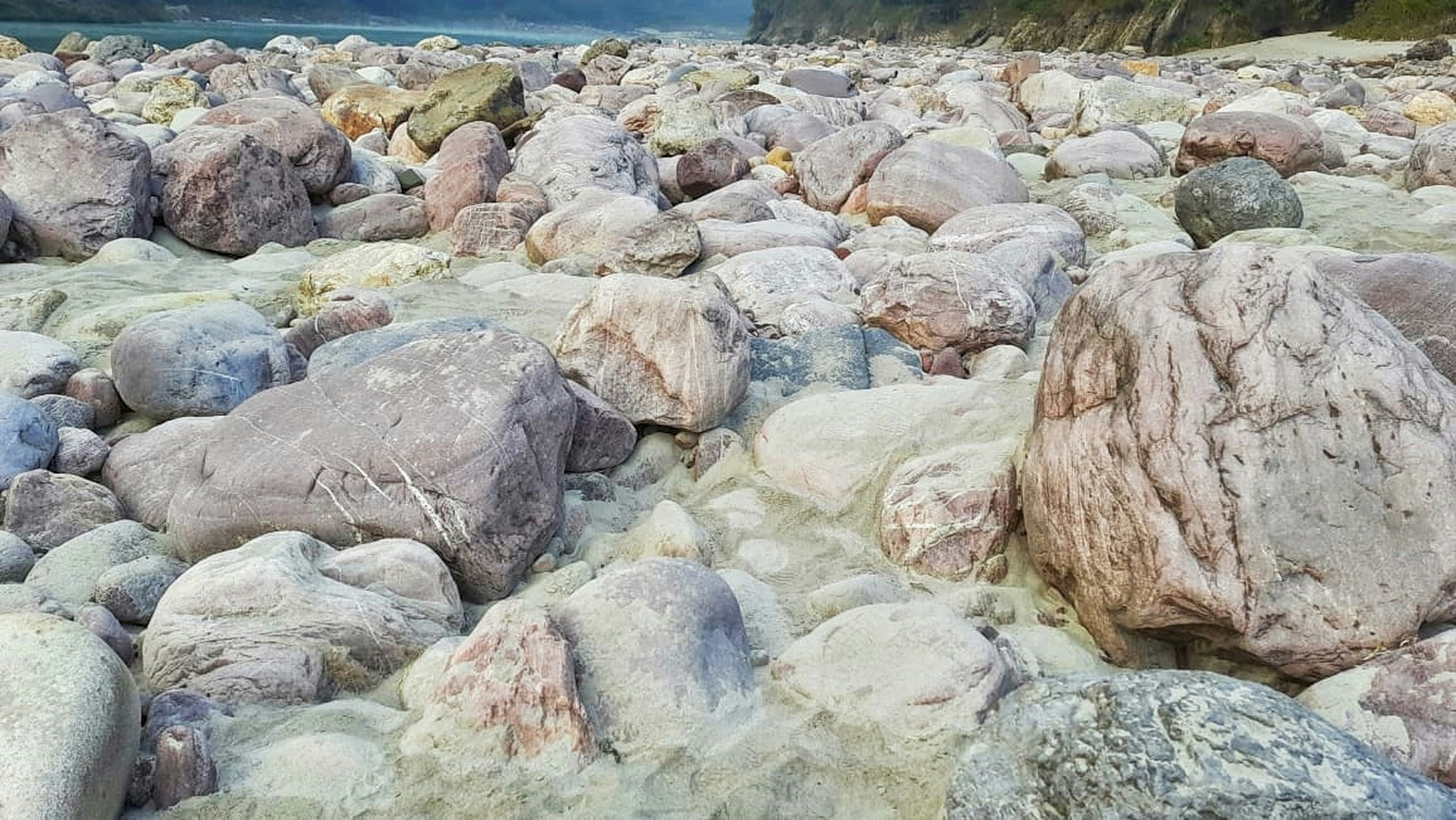 a rocky beach covered in lots of rocks