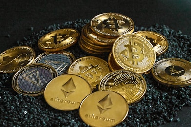 a pile of bitcoins sitting on top of a pile of gravel