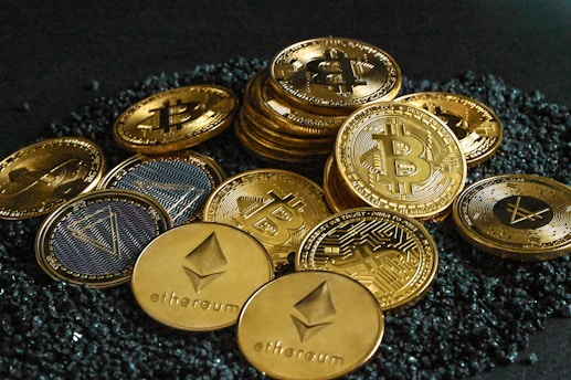 a pile of bitcoins sitting on top of a pile of gravel