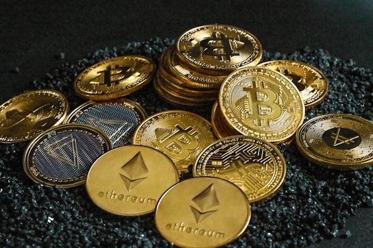 a pile of bitcoins sitting on top of a pile of gravel