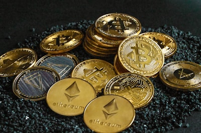 a pile of bitcoins sitting on top of a pile of gravel