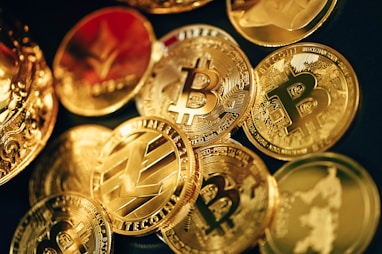 a pile of gold bitcoins sitting on top of each other