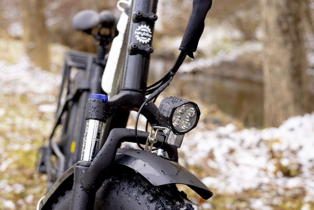 a close up of a bike in the snow