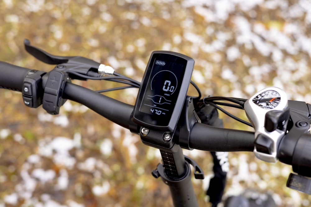 a cell phone mounted to the handlebars of a bike