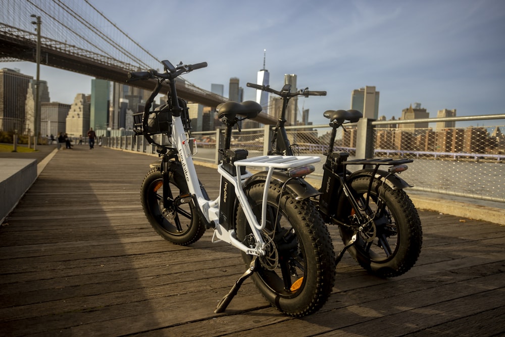 a couple of bikes that are sitting on a wooden floor