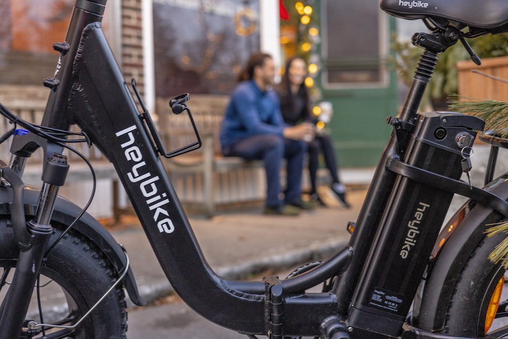 a close up of a bike parked on the side of a street