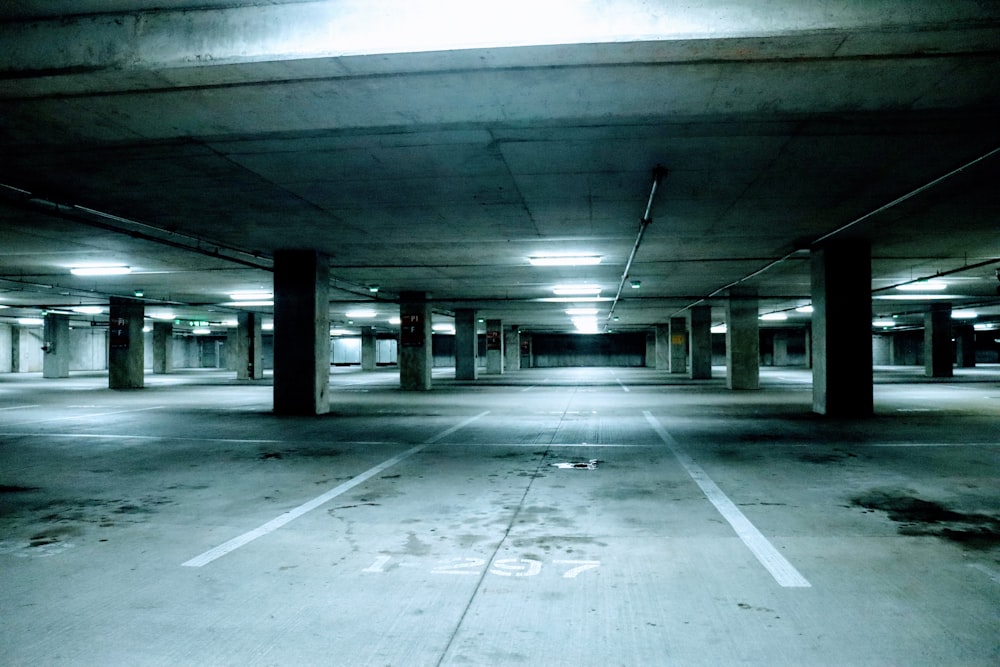 an empty parking garage filled with lots of parking spaces