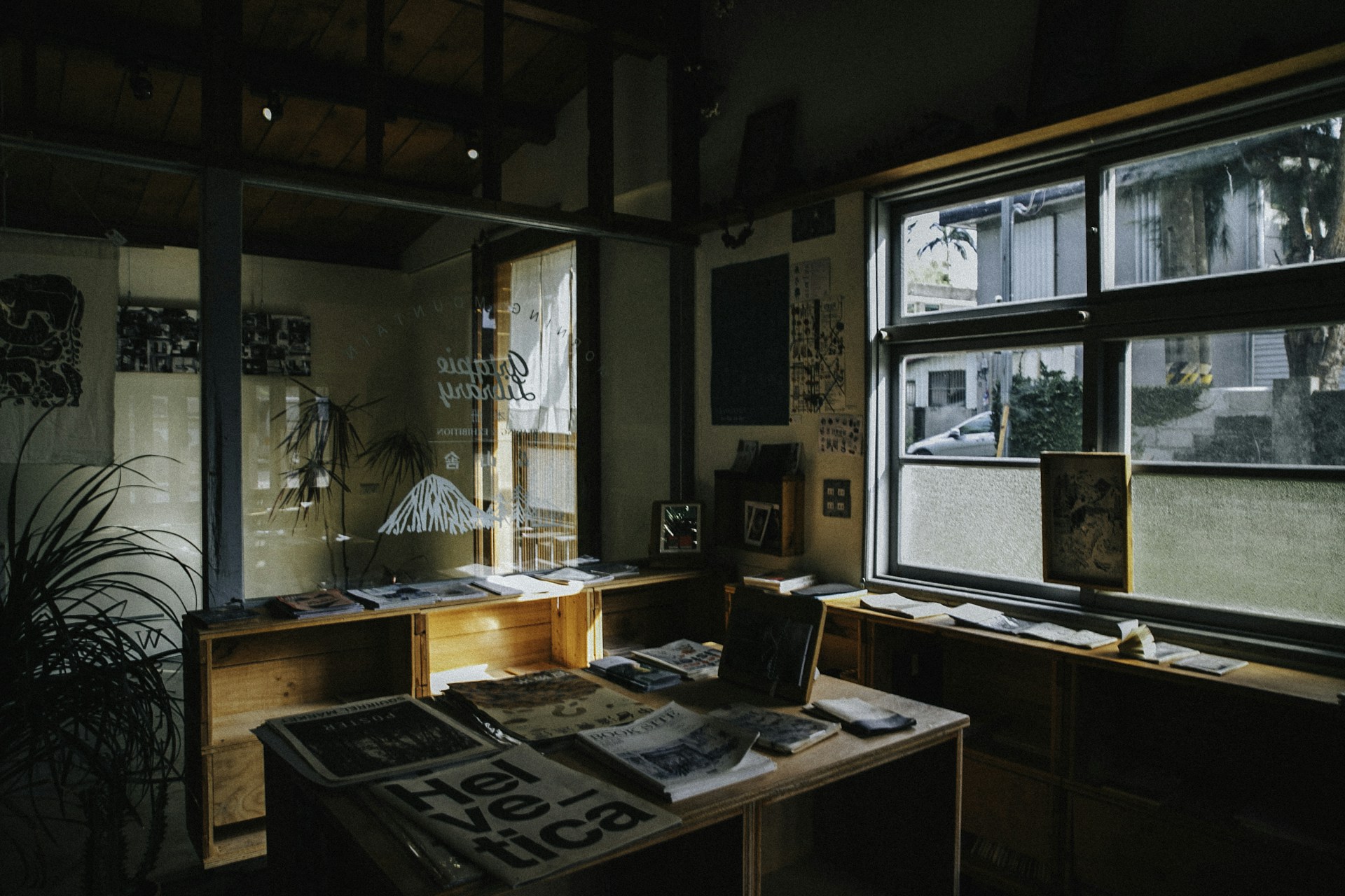 a room with a desk and a large window