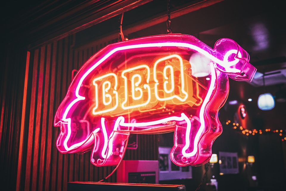 Stock image of a BBQ sign for a BBQ restaurant used in a blog for BBQ restaurant website design by Cannone Marketing