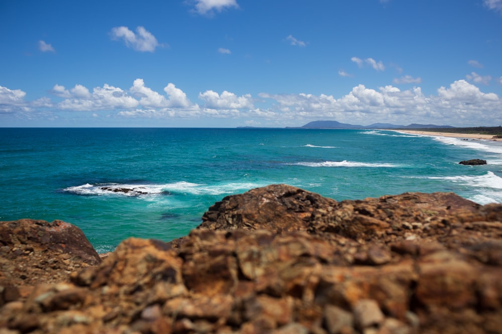 a view of the ocean from a rocky outcropping