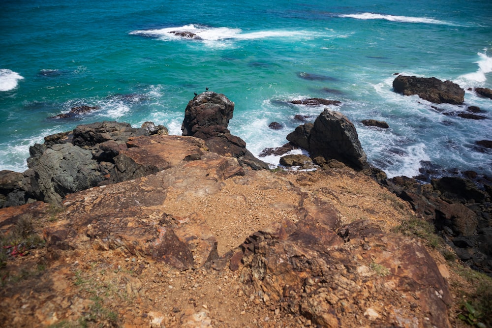 a view of the ocean from the top of a hill