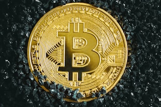 a bitcoin is shown on a black surface