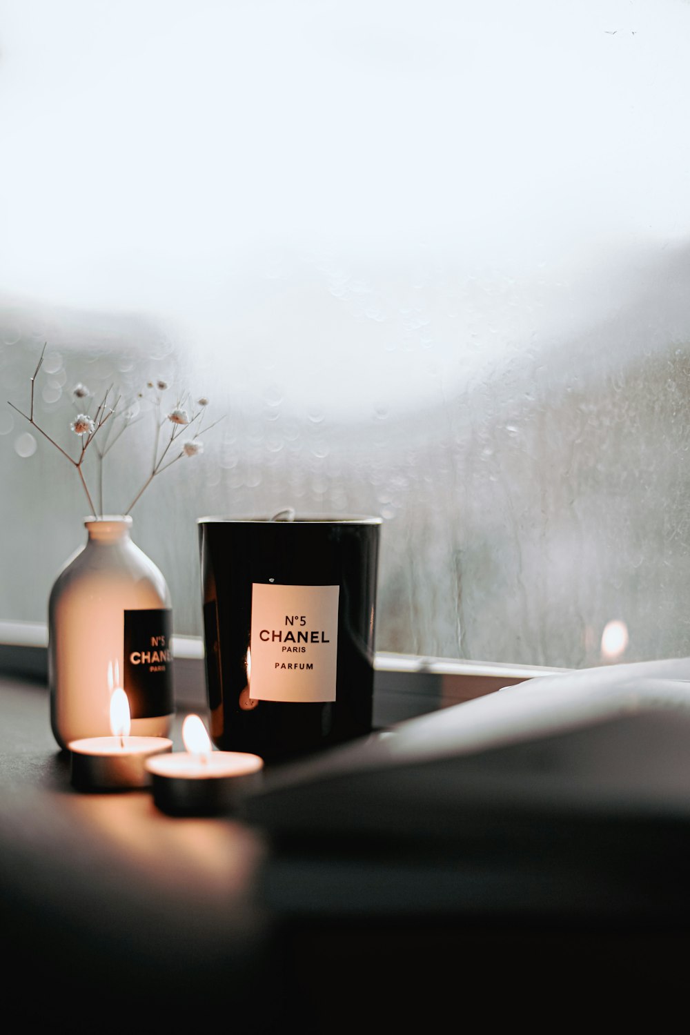 a couple of candles sitting on top of a table