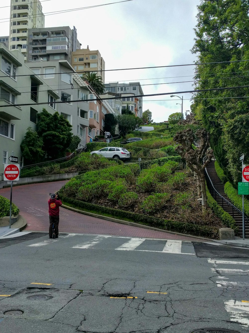 a man standing on the corner of a street