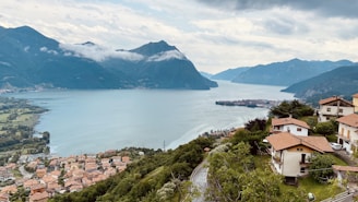 a scenic view of a town and a body of water