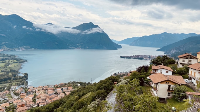 a scenic view of a town and a body of water