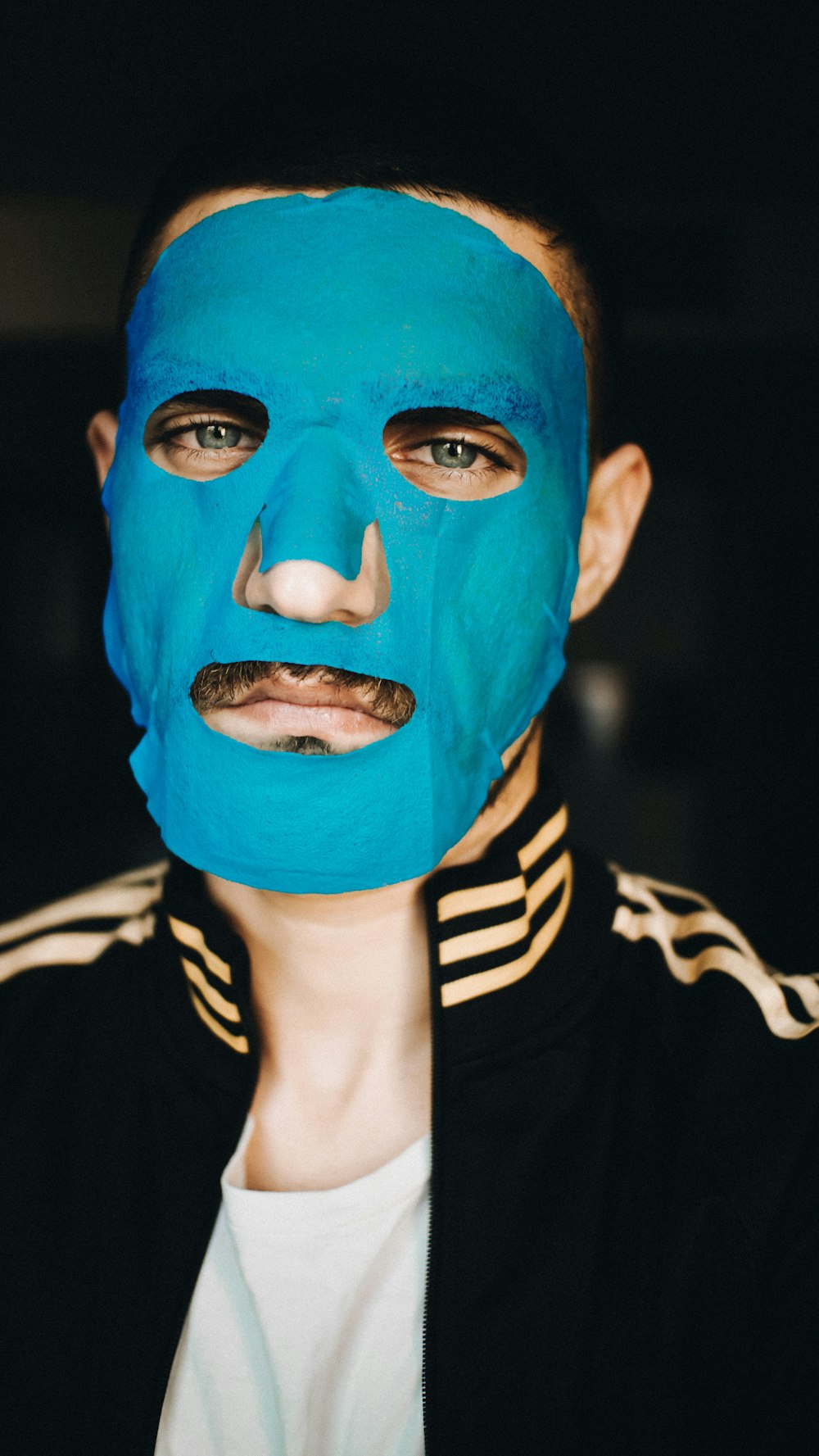 a man with a blue mask on his face