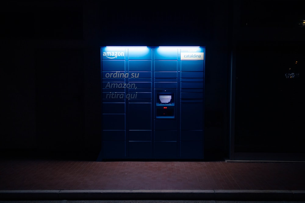 a public restroom with a urinal in the dark