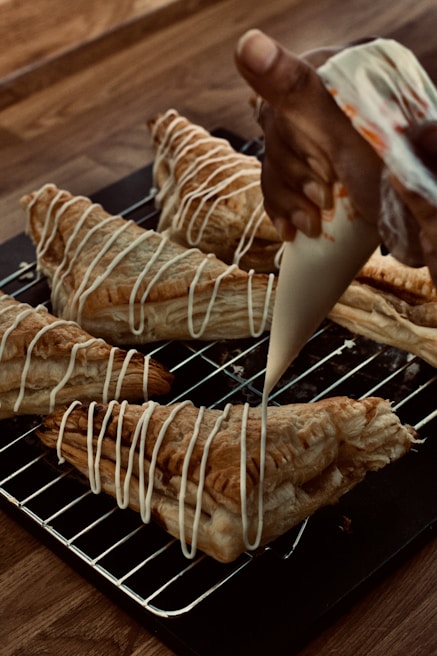 An automated pastry machine in action, creating delicate pastries.