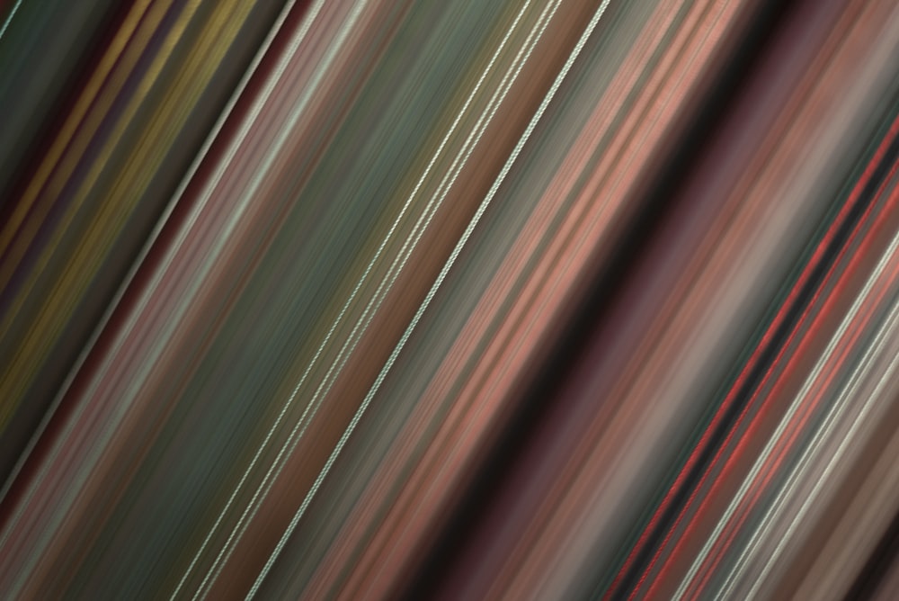 a blurry image of a red and brown striped background