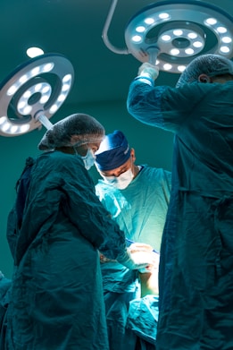 a group of doctors performing surgery on a patient