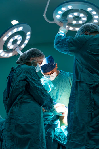 a group of doctors performing surgery on a patient