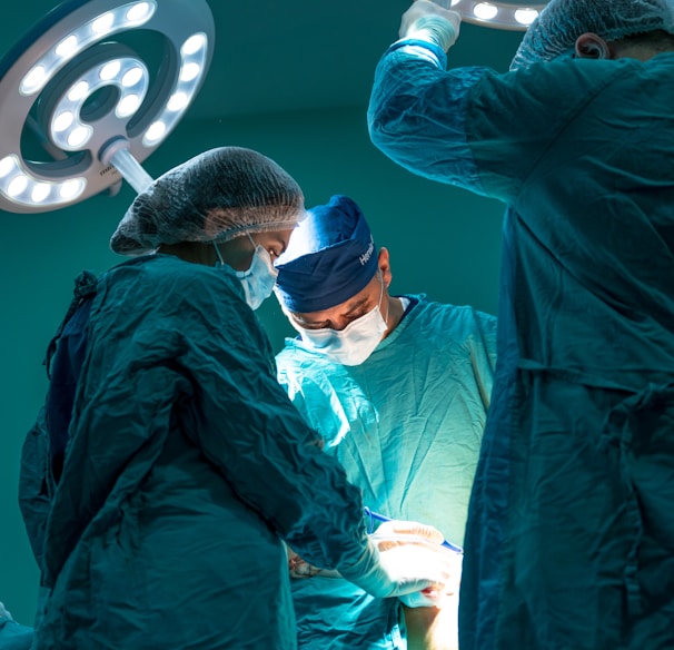 a group of doctors performing surgery on a patient