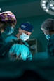 a group of doctors performing surgery in an operating room