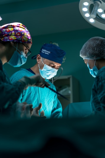 a group of doctors performing surgery in an operating room