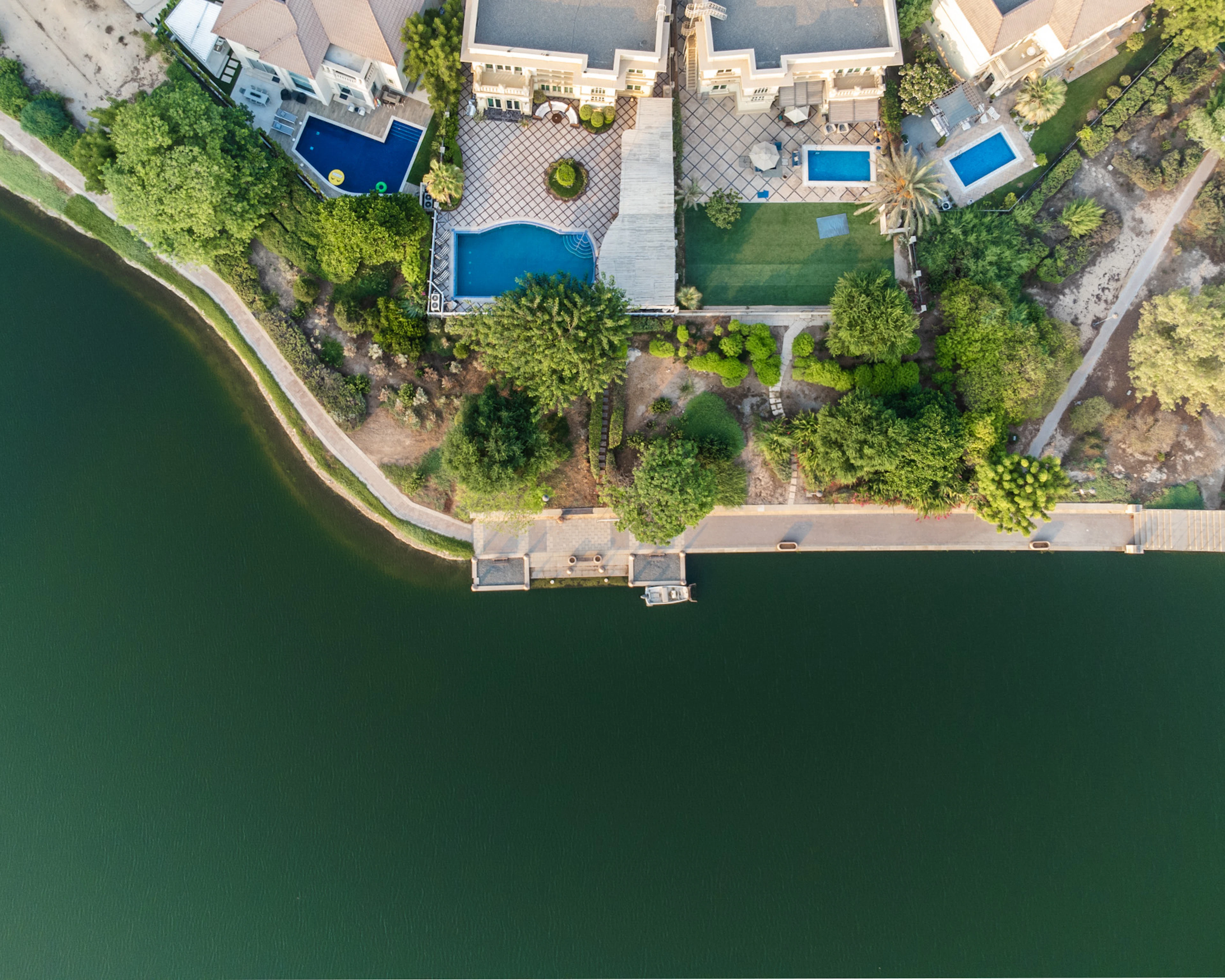 Villas with private pools and gardens beside a lake