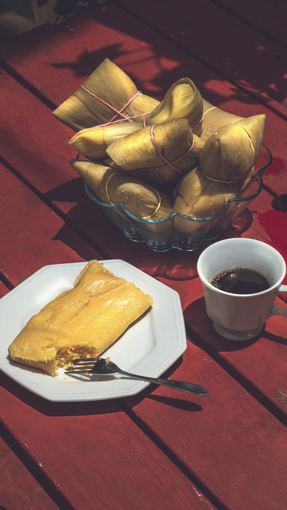 a plate of food and a cup of coffee on a table