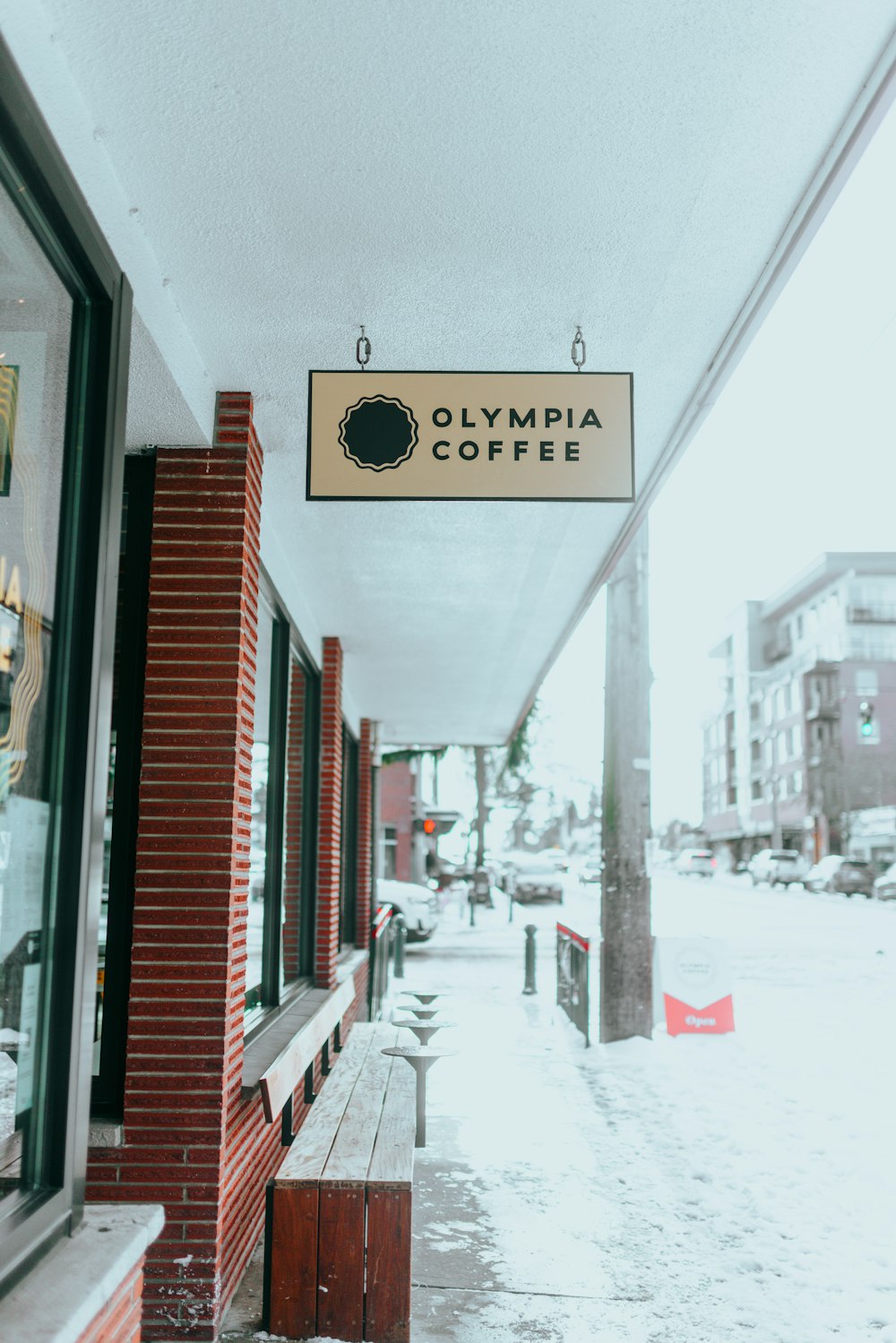 a sign hanging from the side of a building