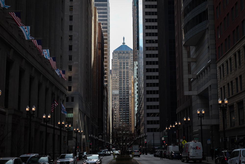 a city street with tall buildings in the background