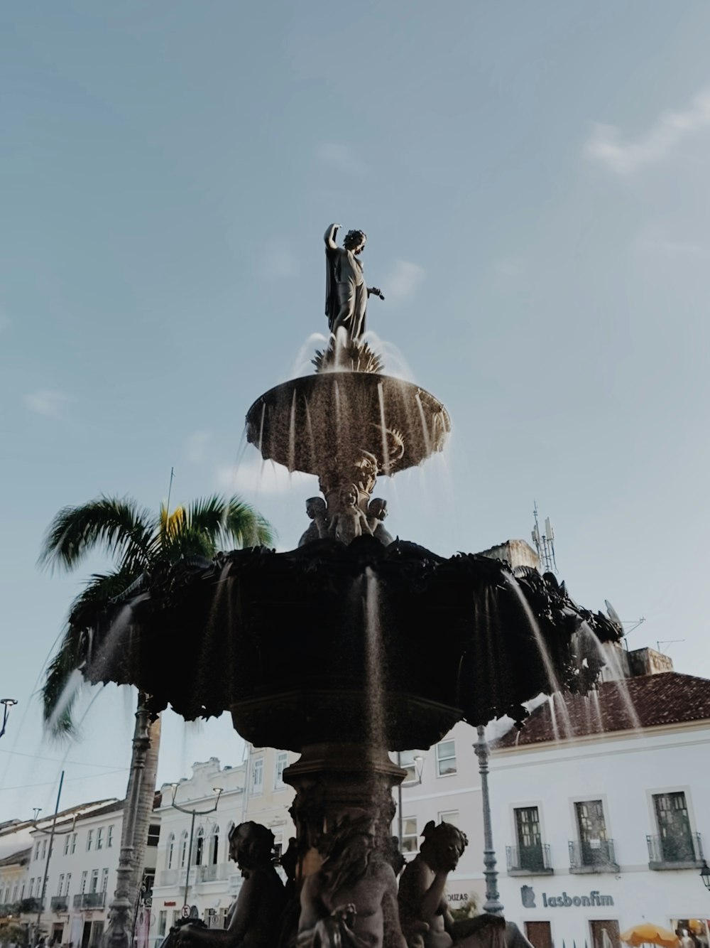 a fountain with a statue on top of it