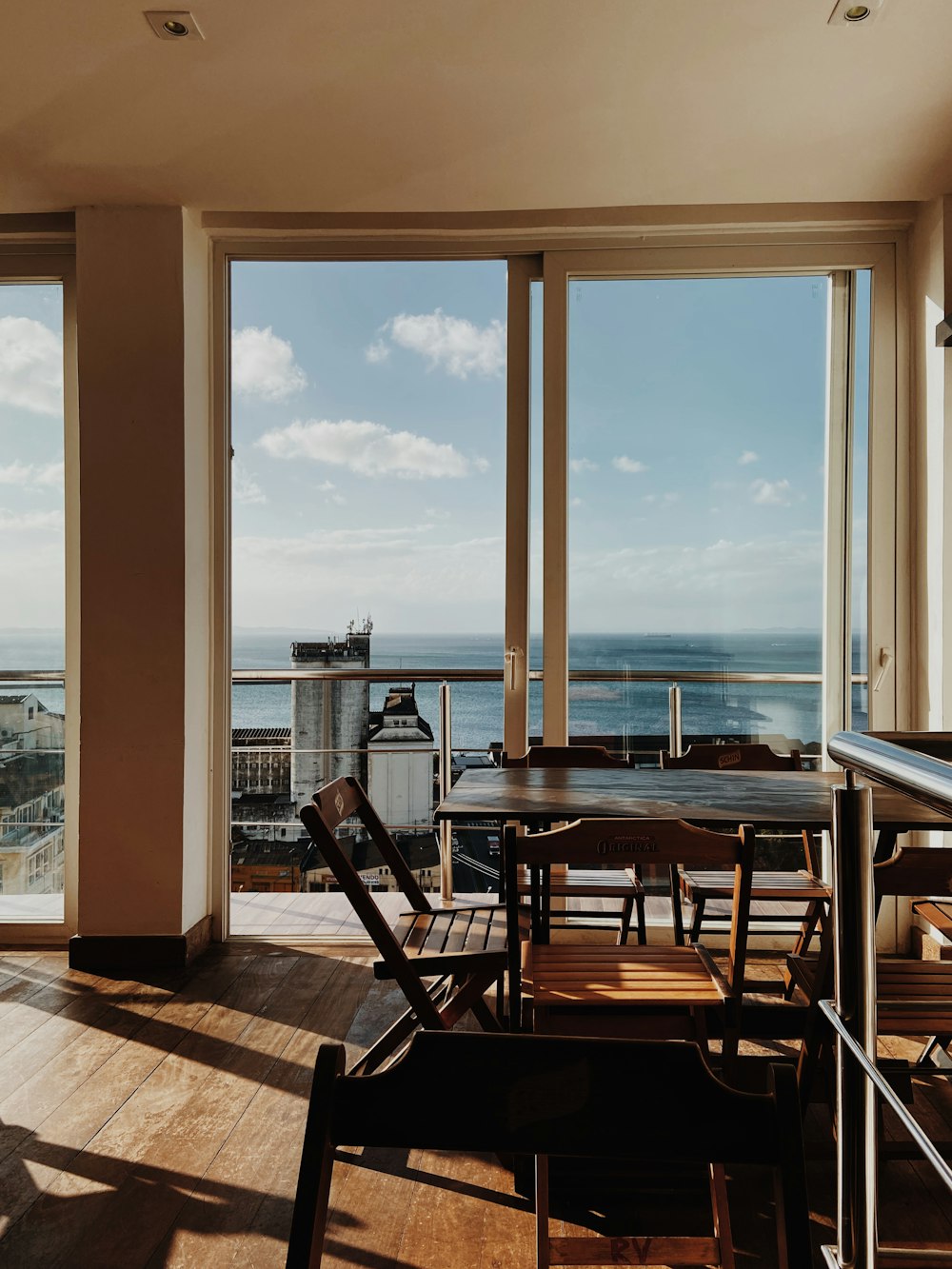 a dining room with a view of the ocean