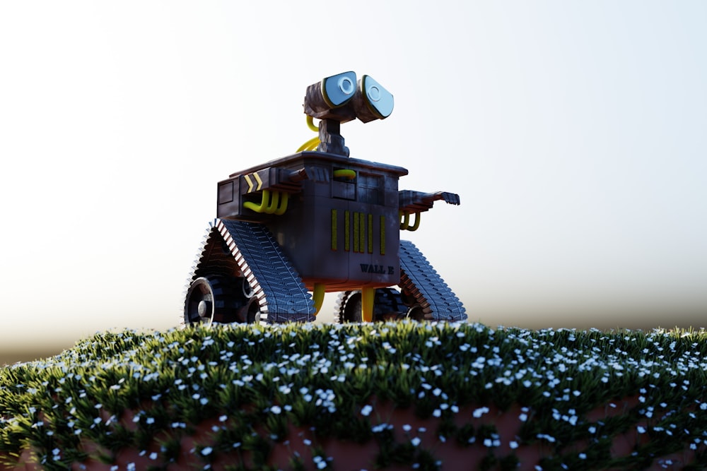 a robot with a camera on top of a hill
