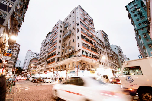 Timelapse of a busy urban neighborhood highlighting different property fronts.