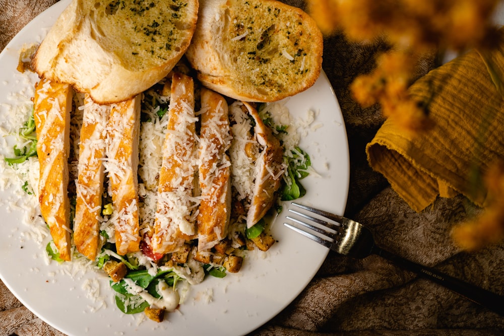 a white plate topped with bread and cheese