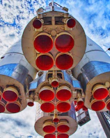 A close-up of a rocket engine igniting during launch.