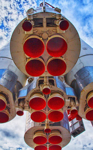 A close-up of a rocket engine igniting during launch.