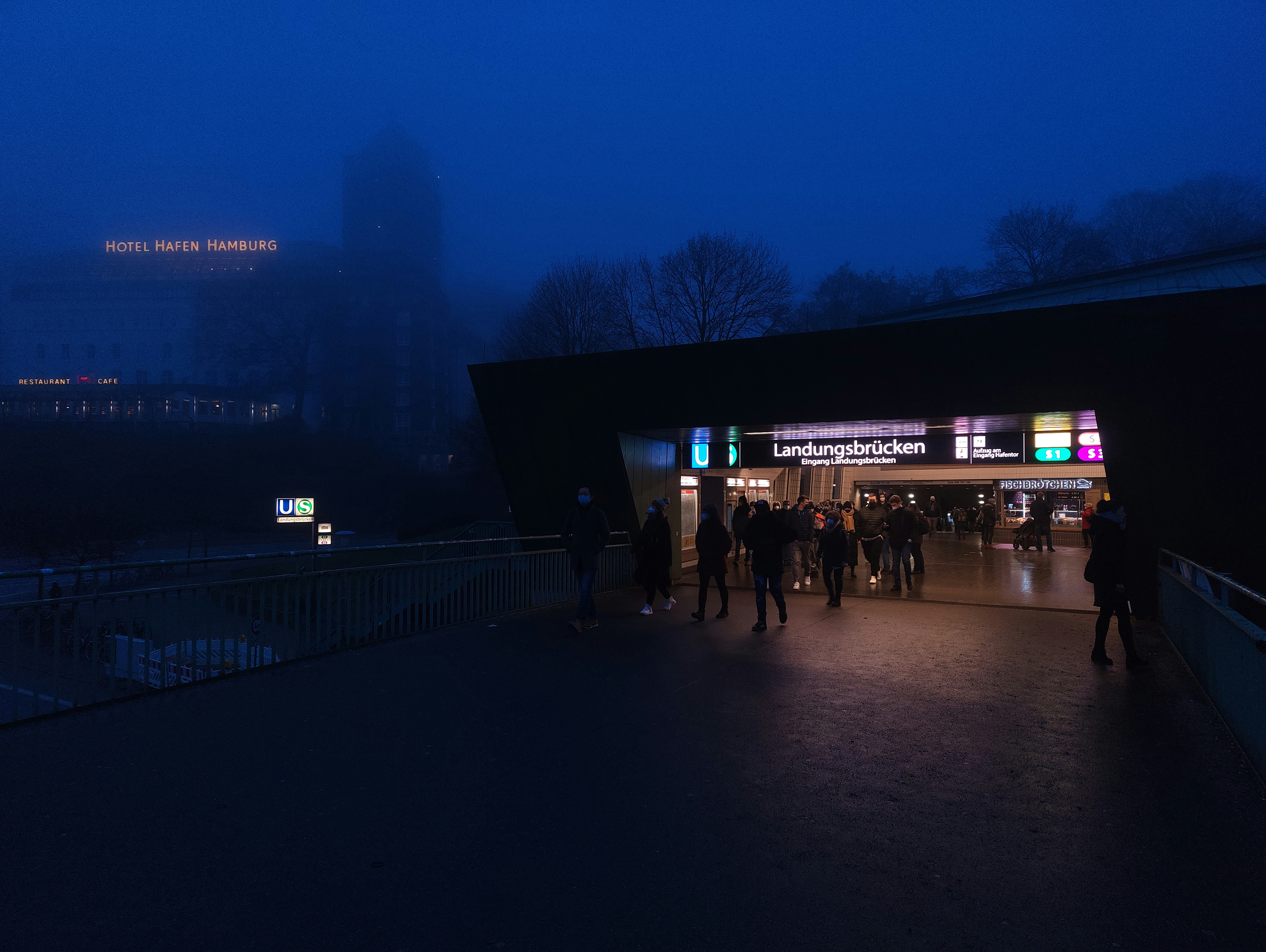 a group of people standing outside of a building